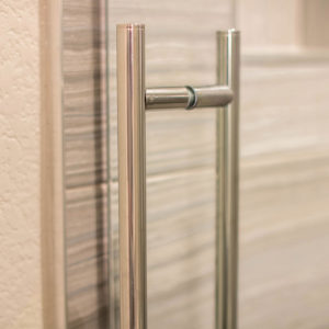 Close-Up of Polished Stainless Steel Handle on Skyline Shower Door Enclosure System